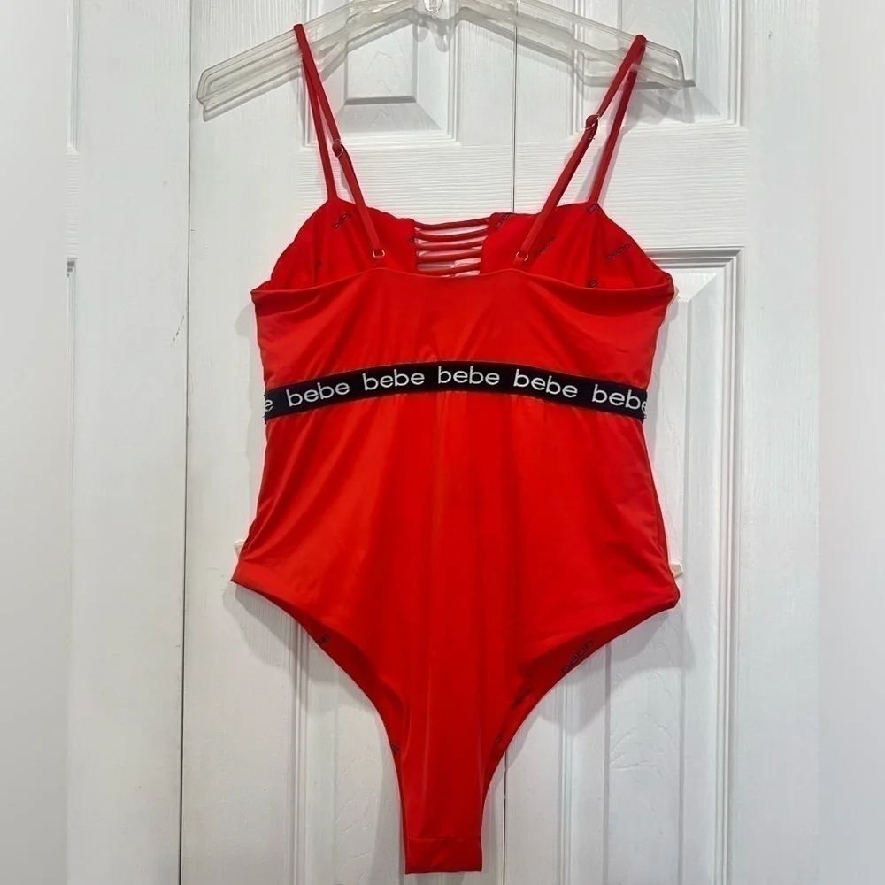 Bebe blood orange red swimsuit black band with logo size XL